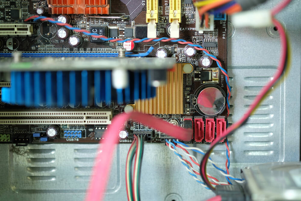 Computer network hardware devices like routers, switches, and cables in office setup